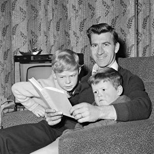 Blackburn Rovers footballer Bryan Douglas at home with his two boys. November 1963