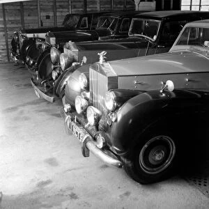 A collection of Veteran Rolls Royce cars stored in a Nissen hut. 1963