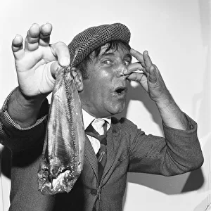 Comedian Norman Wisdom seen here in the persona of hapless on screen character Norman