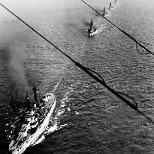 The German High Seas Fleet being escorted to Scapa Flow by a US battleship after