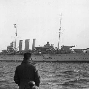 HMS Cornwall, pennant number 56, a County-class heavy cruiser seen here leaving Devonport