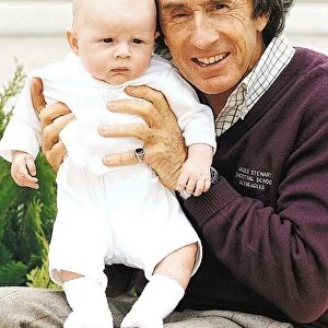 Jackie Stewart holding his grandson Dylan Stewart July 1995
