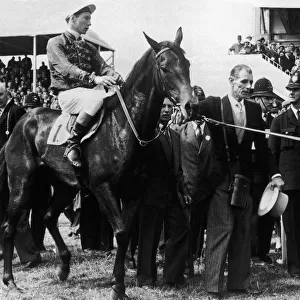 Her Majesty Queen Elizabeth II leading in her horse "Carrogan"