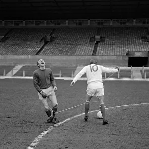 Manchester United players Nobby Stiles and Denis Law playing against each other during a