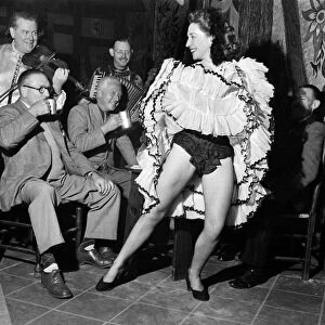 Margaret Madison, 26-year-old redhead, dances the can-can nightly in a Rodley (yorkshire