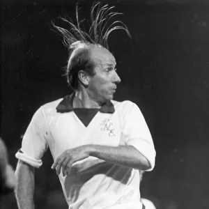 Preston North Ends player manager Bobby Charlton with his hair on end during a Third