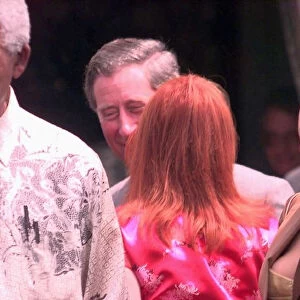Prince Charles gets a kiss from Geri Halliwell outside President Nelson Mandelas house in