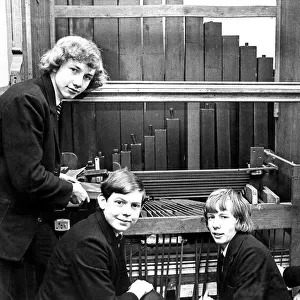 Some of the pupils of Newcastle Cathedral School re-assembling an organ that was given to