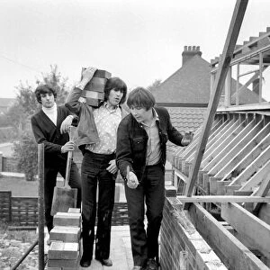 The Troggs, pop group help to build a house for one of their members