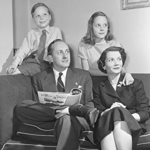 Tv presenter Hughie Green seen here at home with his family. Circa 1955
