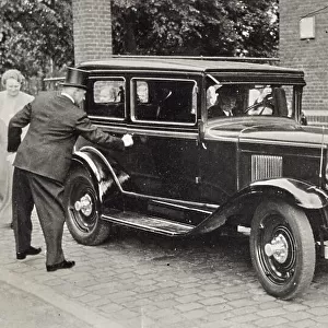 A gentleman with cylinder opens the door of an elegant car