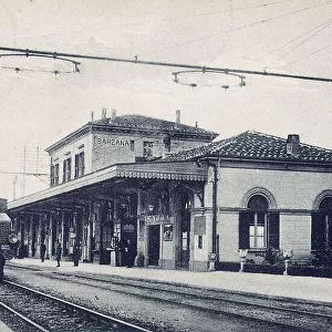 A steam train on the tracks of the train station of Sarzana